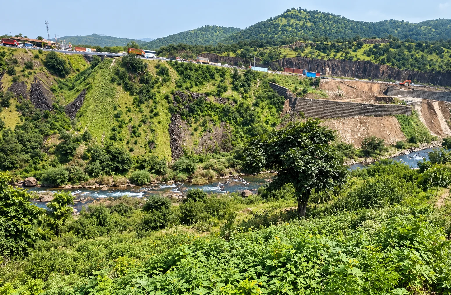 Green hills and flowing river near Kolewadi plots, Taluka Haveli, Pune